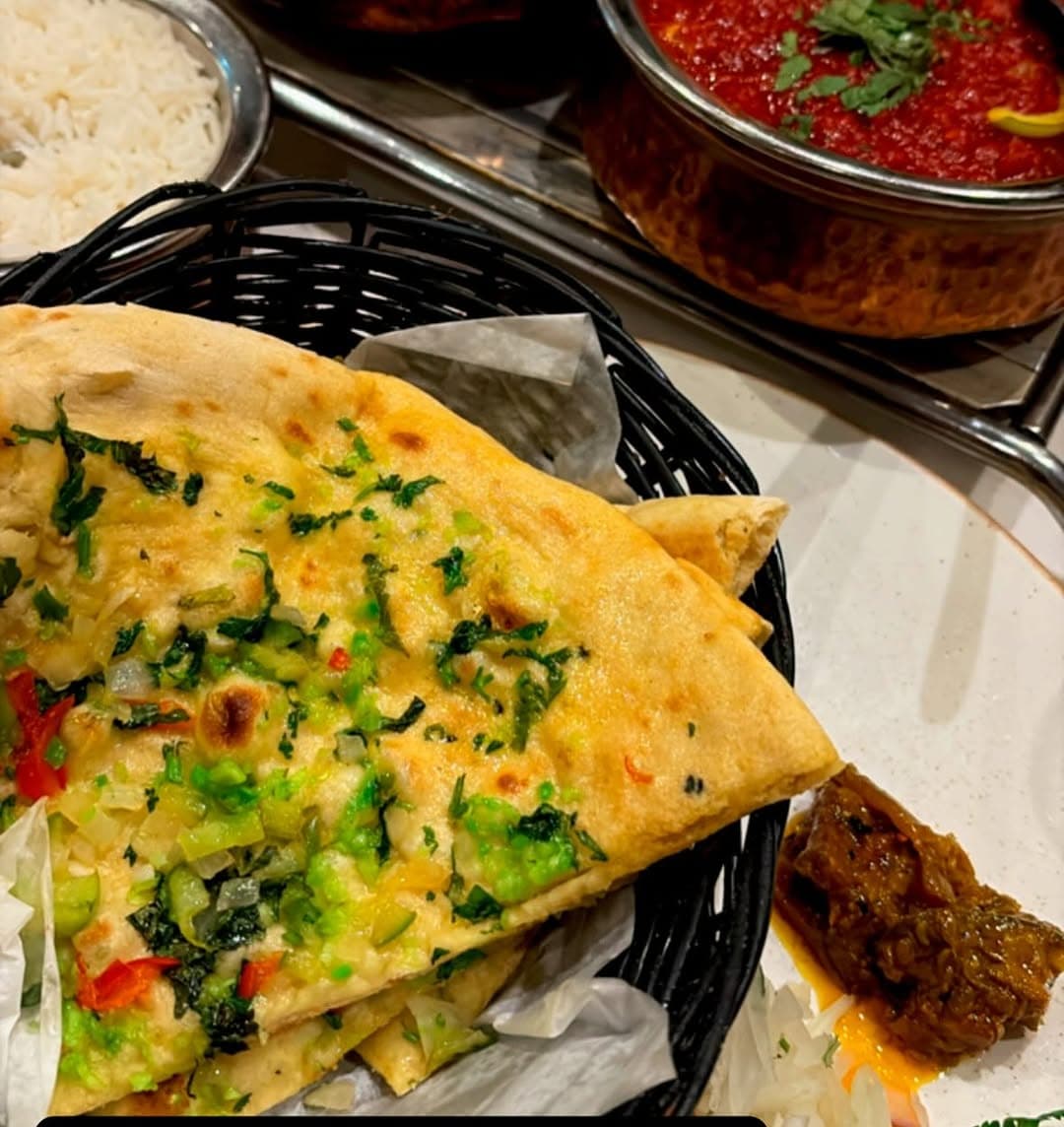House Naan And A Rich Curry Packed For Takeaway